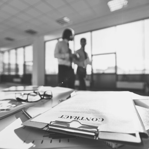 eyeglasses-office-desk-fulll-papers-black-white-scaled (1)