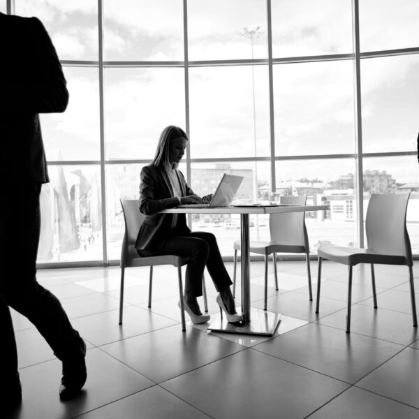 Two businessmen and secretary working in office